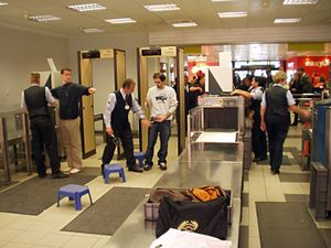 Hand-luggage inspection machine at an airport.